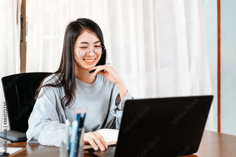 High school or college student learning tutoring on desk and reading, doing homework, lesson practice preparing exam on laptop at home. Education concept. High school or college student learning tutoring on desk and reading, doing homework, lesson practice preparing exam on laptop at home. Education concept.