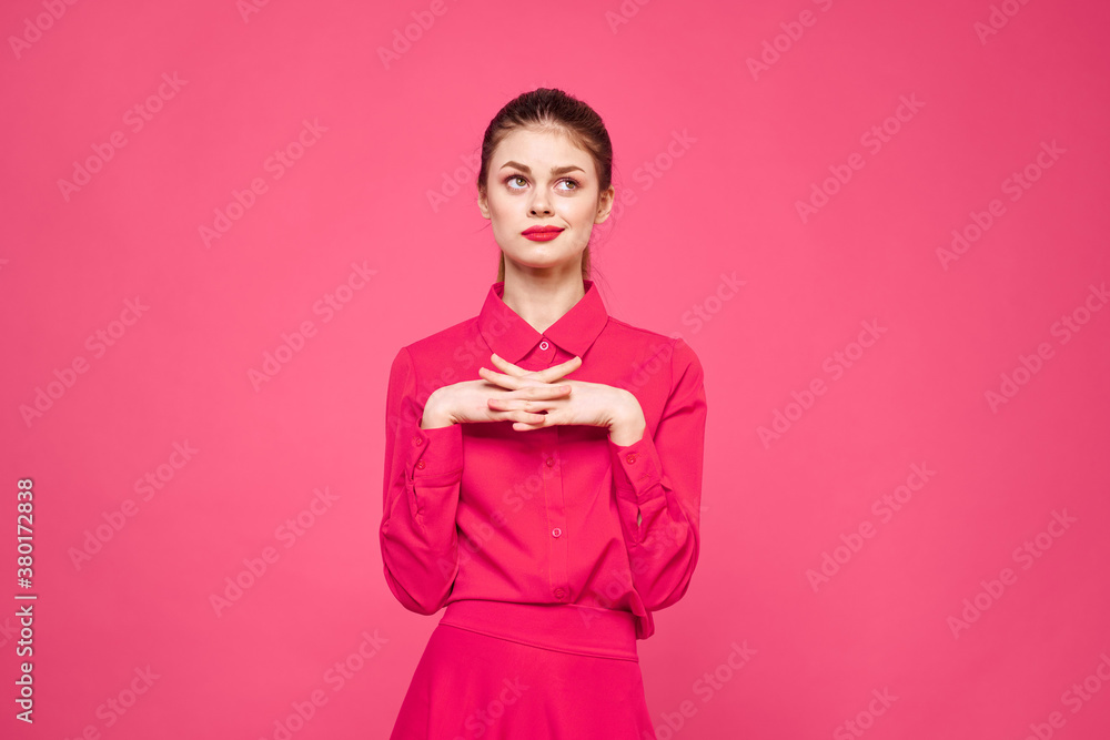Woman on a pink background in fashionable clothes and bright makeup hairstyle model Copy Space Woman on a pink background in fashionable clothes and bright makeup hairstyle model Copy Space