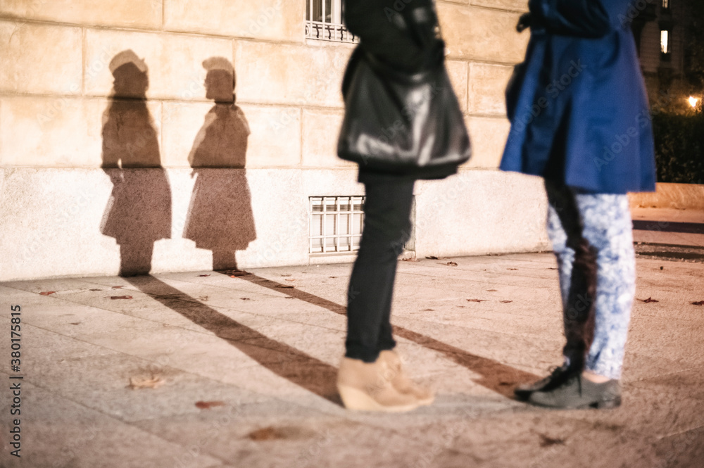 Shadow on the wall of two women Shadow on the wall of two women