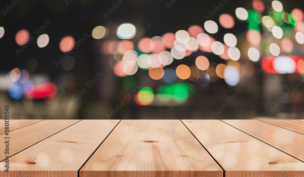 Empty wooden table top with lights bokeh on blur restaurant background
Empty wooden table top with lights bokeh on blur restaurant background
