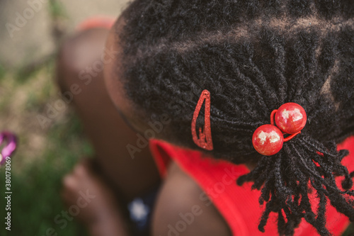 African-American Girl's Hair with USA Flag Color Themed Decorations photo