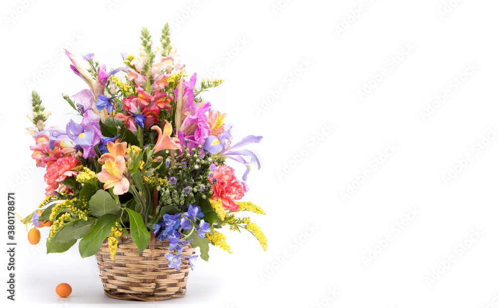 bouquet of bright flowers in basket isolated on white background.Copy Space. . Mothers Day or Valentines Day Concept