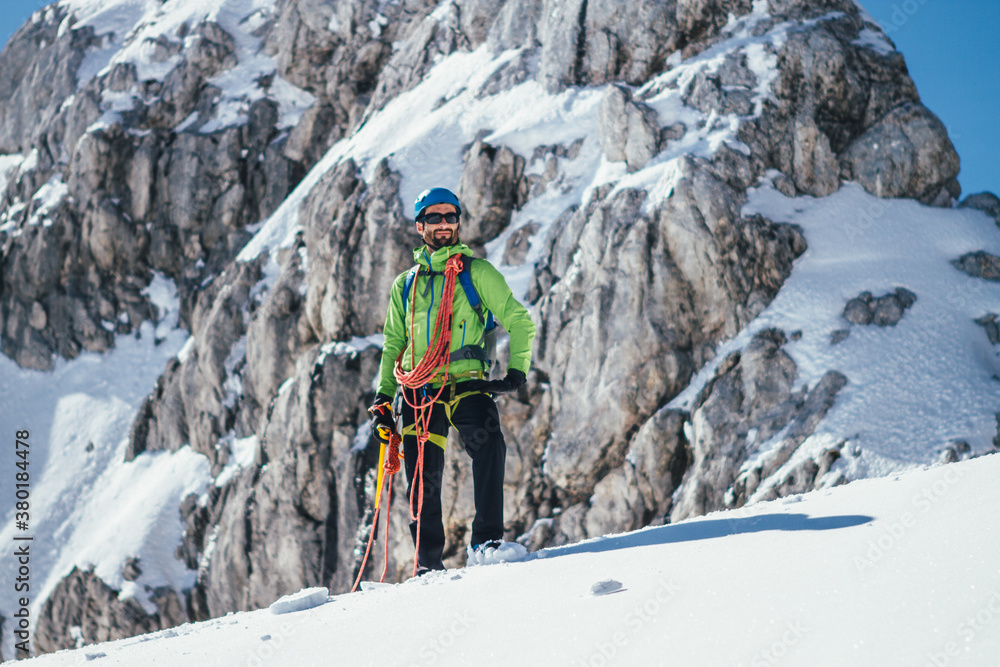 portrait of fully equipped mountaineer on a glacier portrait of fully equipped mountaineer on a glacier