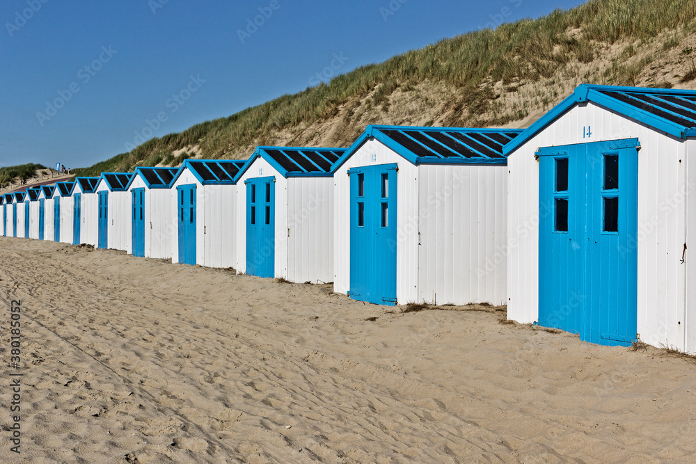 Row of white and blue beach huts Row of white and blue beach huts