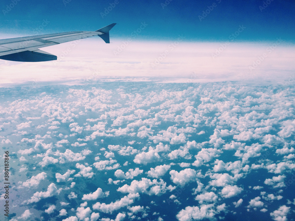Aerial view of sky with plane wing Aerial view of sky with plane wing
