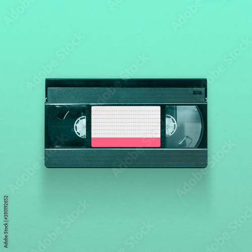 VHS video tape cassette isolated on blue background, pop art design, close up