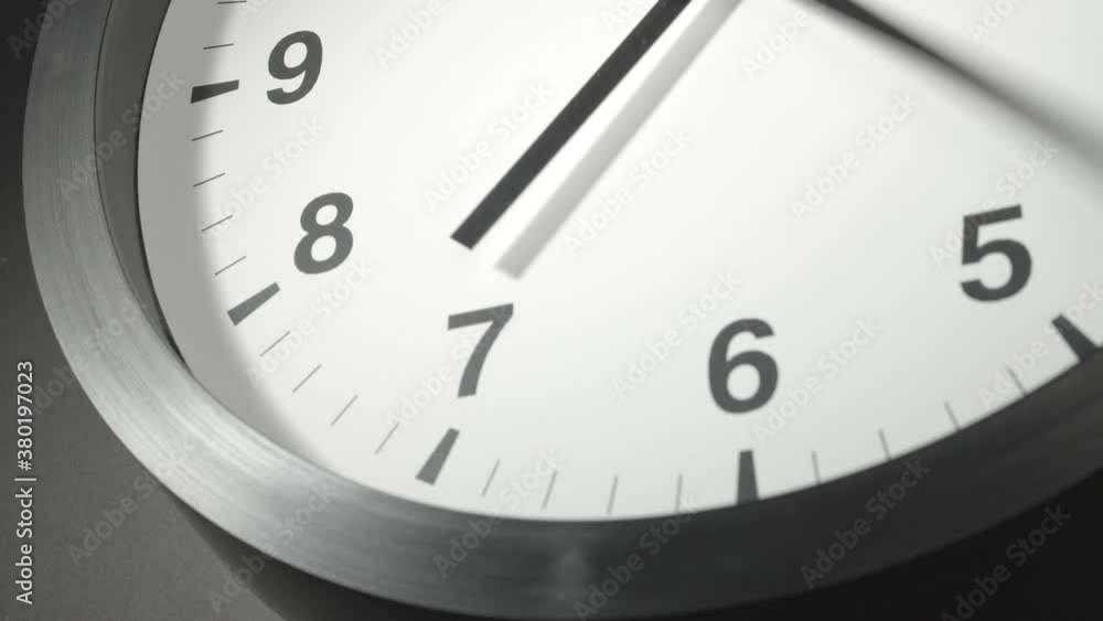 Clock Face in Time Lapse on Dark Grey Wall Clock Face in Time Lapse on Dark Grey Wall