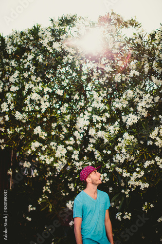 Handsome stylish man getting in touch with his inner flower child photo