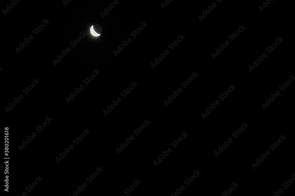 Crescent moon in dark night sky Crescent moon in dark night sky