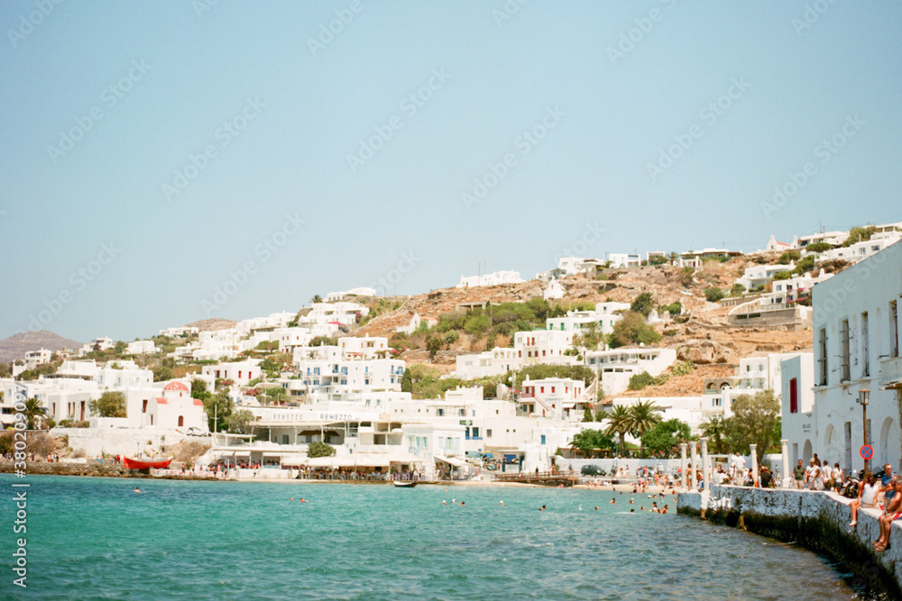 Coastal views of tourists in the town of Mykonos, Greece Coastal views of tourists in the town of Mykonos, Greece