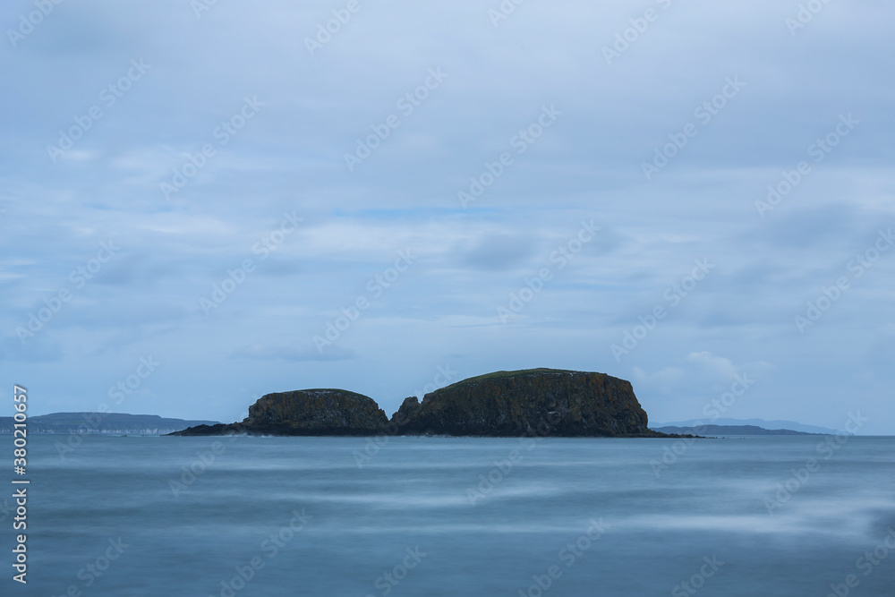 Islet of the coast of Northern Ireland on a cloudy day Islet of the coast of Northern Ireland on a cloudy day