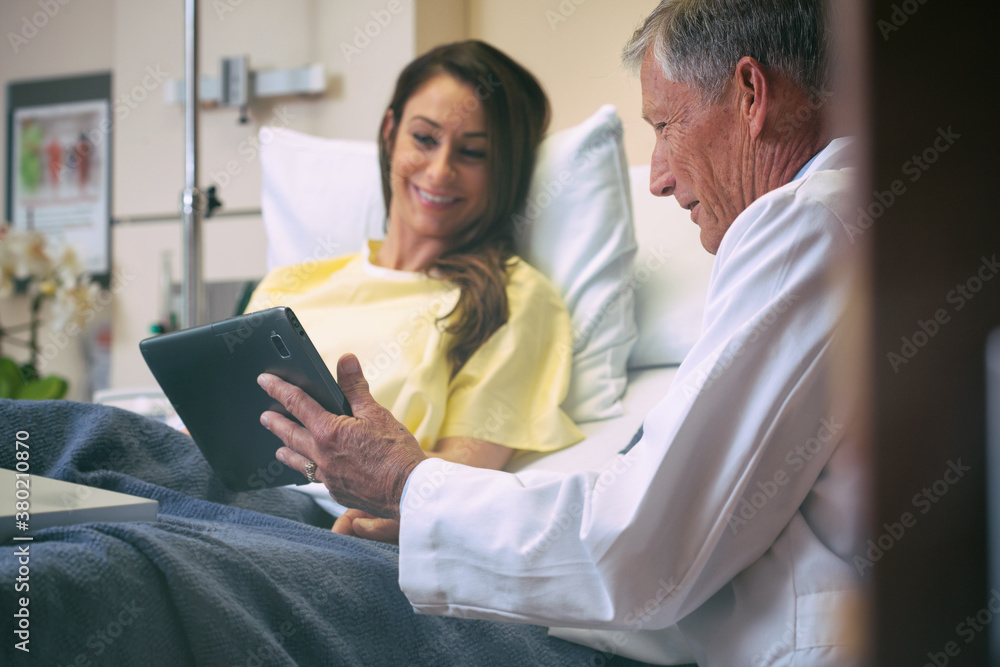 Hospital: Doctor Shows Test Results To Female Patient. Hospital: Doctor Shows Test Results To Female Patient.