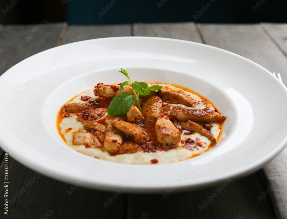 Chicken saute on mashed potatoes horizontal view