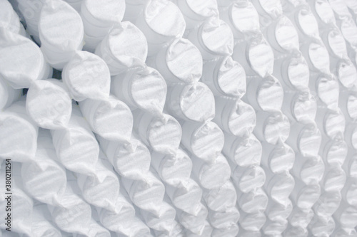 Independent springs. Mattress springs in covers. Selective focus.