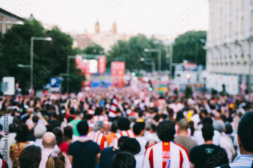 Group of soccer supporters celebrating on the street their team victory on a soccer championship photo