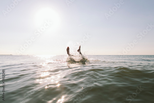 Feet sticking out of the ocean. photo