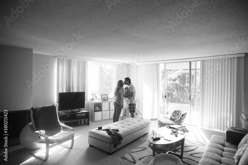 Wide angle view of couple and newborn baby in Living room photo