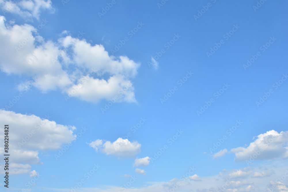 Fototapeta premium Blue Sky With Scattered Clouds With A Sun 