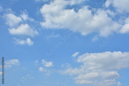 Fototapeta Naklejka Na Ścianę i Meble -   Blue Sky With Scattered Clouds With A Sun 

