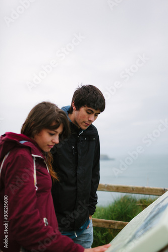 Young Couple Visiting Rocky Island . Northern Ireland photo