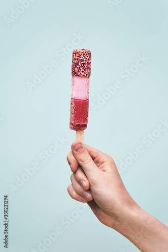 Hand holding popsicle