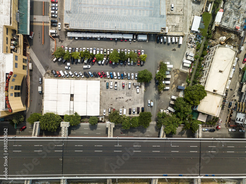 Top view of an elevated highway and a parking lot. Aerial of the Metro Manila Skyway in the Philippines. photo