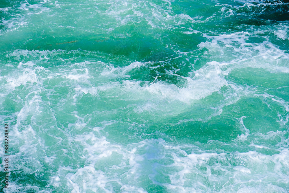 thundering ocean waves or waves on the sea with churned water or stern water of a ship thundering ocean waves or waves on the sea with churned water or stern water of a ship