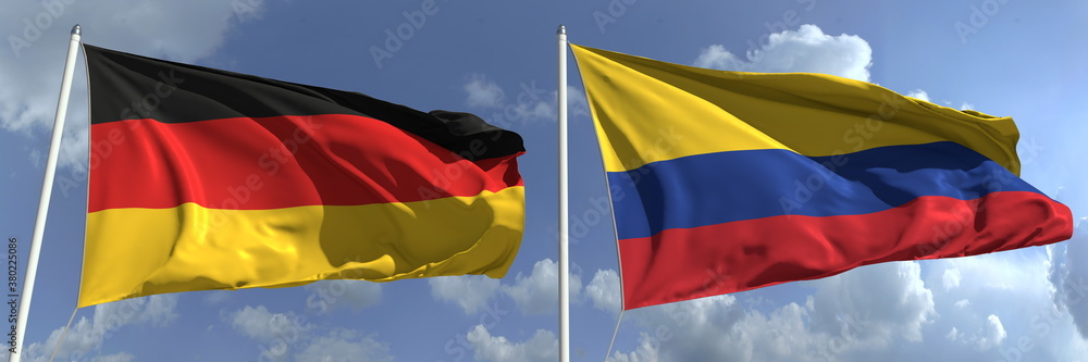 Flying flags of Germany and Colombia on sky background, 3d rendering Flying flags of Germany and Colombia on sky background, 3d rendering