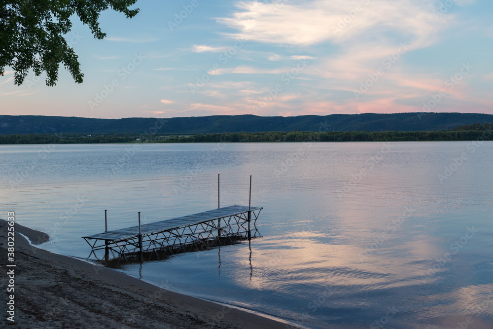 floating dock on a lake at sunset floating dock on a lake at sunset