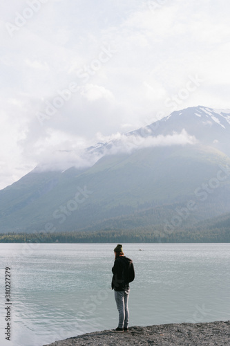 Man Standing By Lake