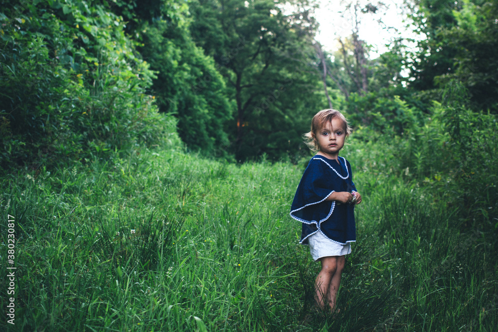 Toddler Girl Standing on an Old Farm Road Toddler Girl Standing on an Old Farm Road