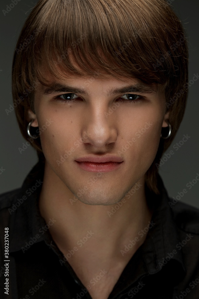 Studio portrait of handsome young man. Clean shaven man