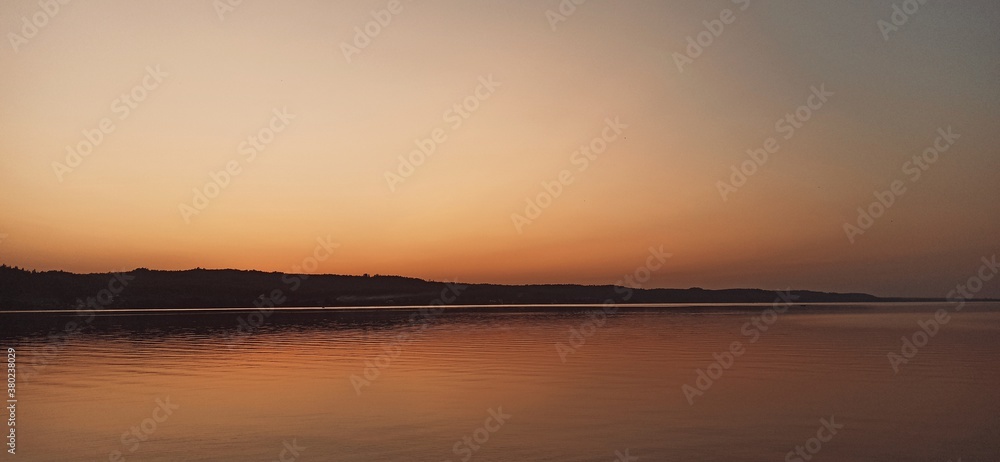 Fototapeta premium sunset over the river