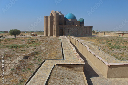 Mausoleum of Khoja Ahmed Yasawi in Turkestan in Kazakhstan is a famous islamic pilgrimage site and UNESCO World Heritage. The Mausoleum with a timurlane architecture is located at the old silkroad. photo