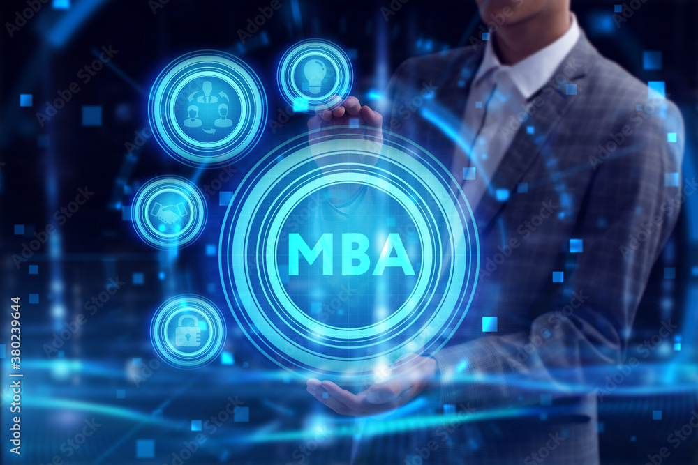 Business, Technology, Internet and network concept. Young businessman working on a virtual screen of the future and sees the inscription: MBA Business, Technology, Internet and network concept. Young businessman working on a virtual screen of the future and sees the inscription: MBA