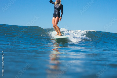 Girl surfing a great Californian wave photo