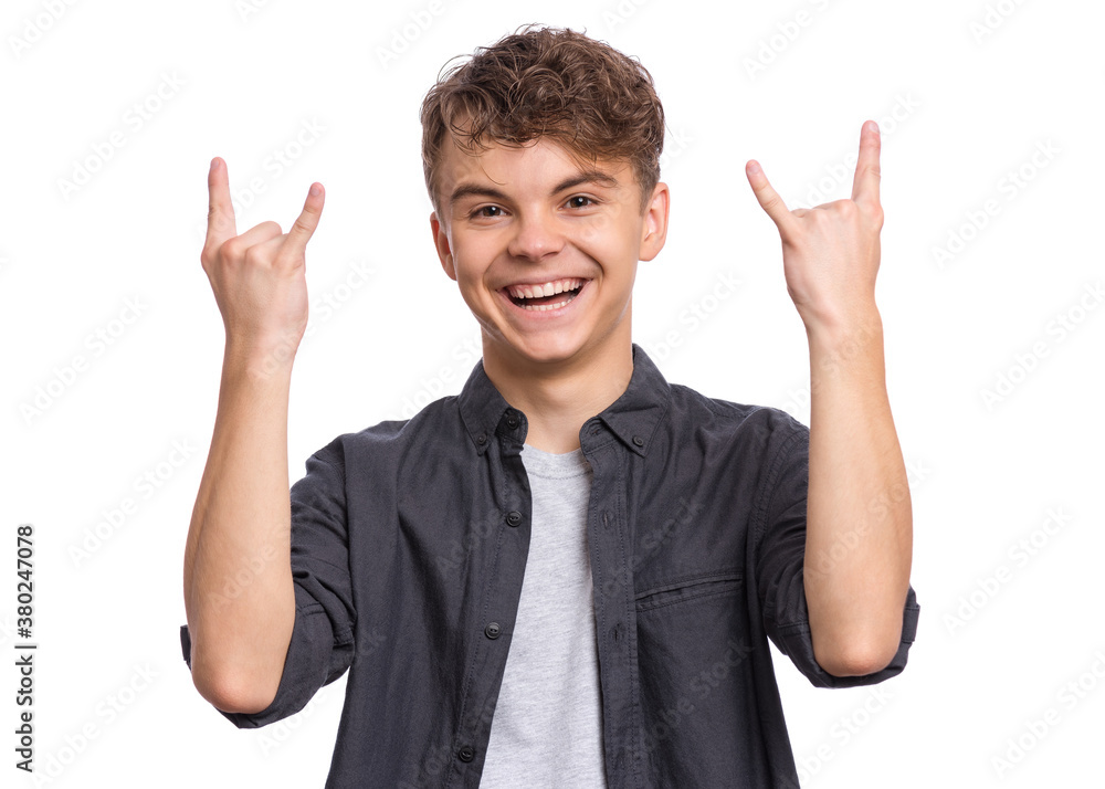 Portrait of handsome teen boy making Rock Gesture. Happy cute child isolated on white background. Portrait of handsome teen boy making Rock Gesture. Happy cute child isolated on white background.