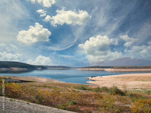 Koprinka Dam, Bulgaria in autumn.
Its water has decreased. You can see its bottom. photo