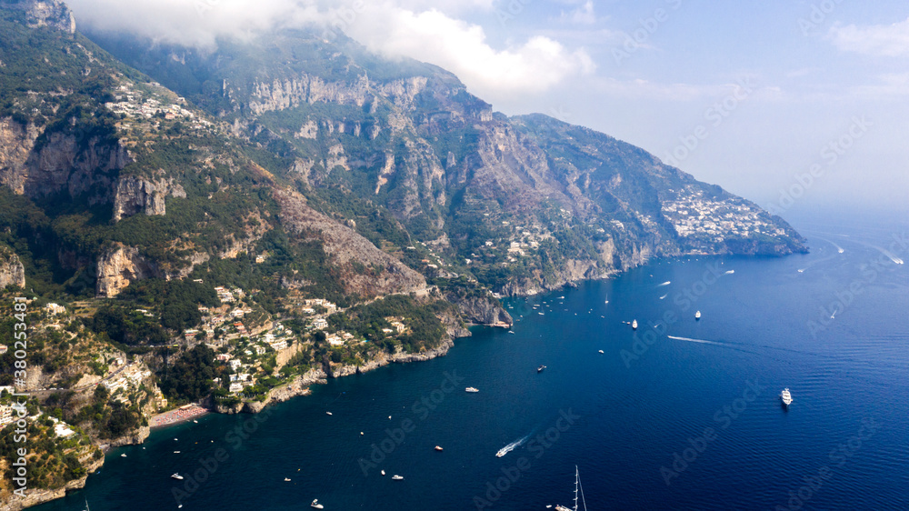 View of the panorama of the Amalfi Coast between Positano and Amalfi, in Campania, Italy. This section is frequented by tourists from all over the world to visit the scenery, the sea and the beaches.
