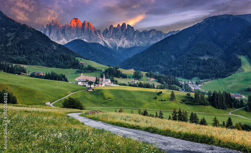 Incredible view on Mountain valley during sunset in dolomites Alps with colorful sky. Amazing nature Scenery for background. Santa Maddalena village best popular location for photographer in world.
