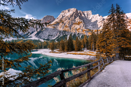 Incredible view on majestic famouse lake Braies in autumn season. Wonderful sunny landscape in dolomites Alps with perfect blue sky. Amazing nature Scenery. Lake Braies is also known as Lago di Braies