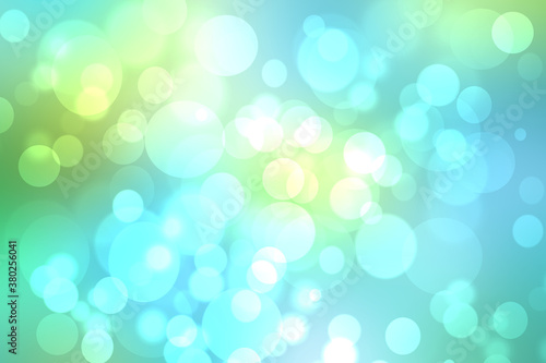 Abstract gradient green light turquoise blue shiny blurred background texture with circular bokeh lights in soft color style. Beautiful backdrop. Space for design.