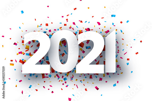 2021 paper sign on confetti background.