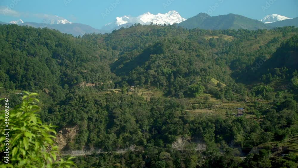 View of mountains covered in lush green vegetation, Lamjung, Nepal View of mountains covered in lush green vegetation, Lamjung, Nepal