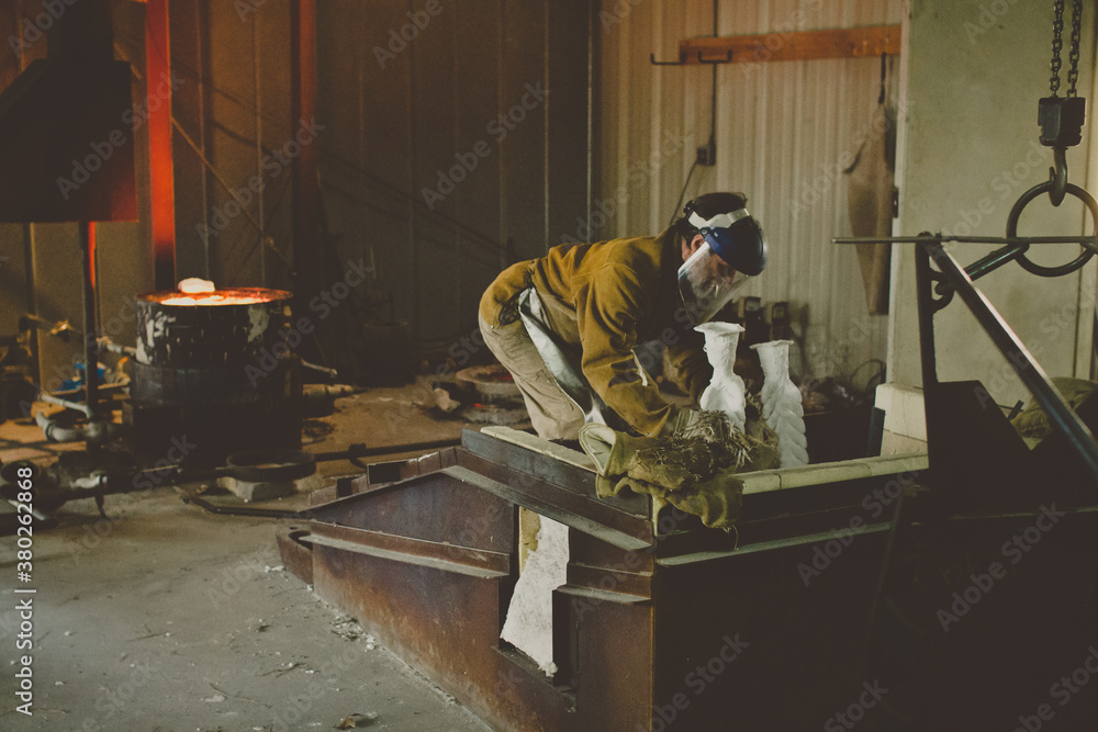 craftsman setting mold in sandbox. craftsman setting mold in sandbox.