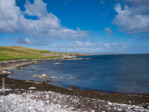 On a sunny day in summer, a view of the scenic, deserted coastline near Aywick on the east of the island of Yell in Shetland, Scotland, UK
