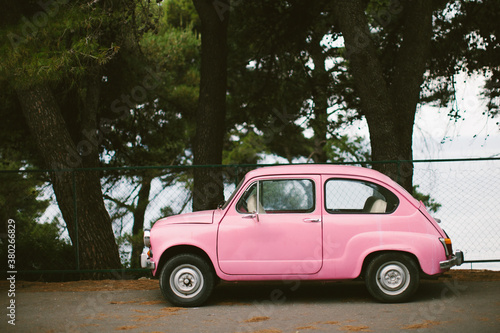 Tiny pink vintage car photo