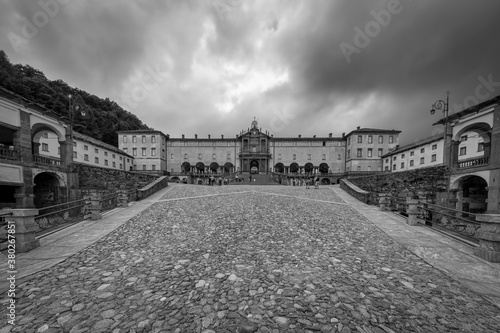 Panoramic view of the buildings on the religious complex named Sanctuary of Oropa near the city of Biella (Piedmont, Northern Italy); well-known religious center of Christian devotion. Black and white