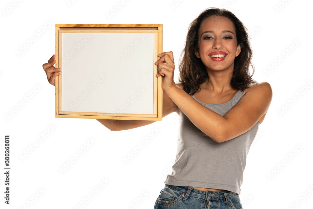 Happy dark skinned woman holding empty whiteboard Happy dark skinned woman holding empty whiteboard