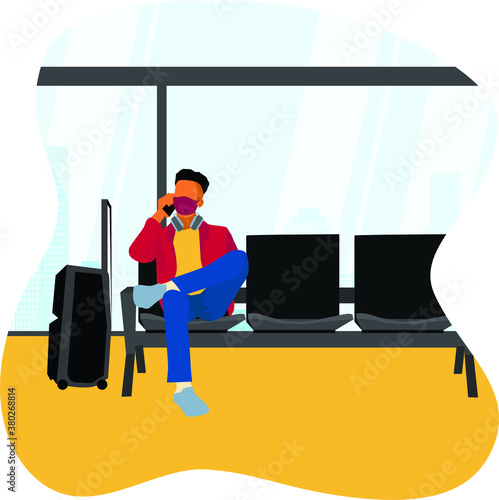 A man waiting for the airplane at the airport waiting room